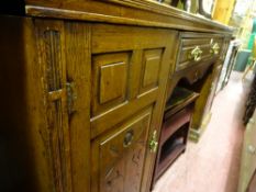 Edwardian sideboard with centre drawer and two flanking carved front cupboard doors, 182 cms wide