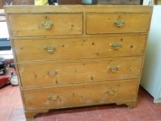Antique stripped pine chest of two short over three long drawers having cock beaded edging and