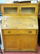 Vintage blonde oak and pine fall front bureau cupboard with bookcase top, 142 cms high, 101 cms