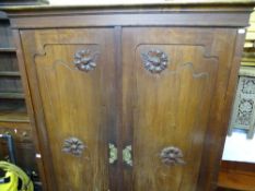 Possibly European wardrobe with carved door front and base drawer