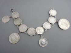 Bracelet of nine Spanish silver fifty cent coins together with a two peseta coin and a one peseta
