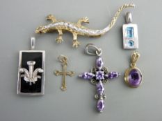 Nine carat gold oval amethyst drop pendant, a tiny believed gold cross, three other pendants and a