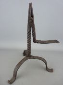 Early 19th Century rushlight holder with twist column on a tripod base with semi-scrolled feet,