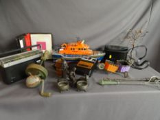 Box of miscellaneous items to include a remote control RNLI lifeboat, a Phillips radio, a Kodak