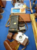 Selection of vintage cameras and associated material