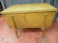 Early 19th Century pine dough bin on a supporting four legged frame, with lift-off lid, 65.5 cms