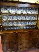 Late 19th Century oak Anglesey dresser having a three shelf rack over a breakfront base having three