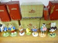 Collection of boxed Royal Doulton figurines including four Rupert characters, 2004 Bunnykins of