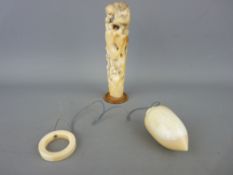 Japanese carved possibly parasol handle and a plumb-bob, the handle detail showing monkeys gathering