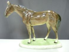 Austrian porcelain study of a standing horse, 31 cms high