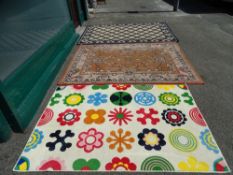 Four various coloured modern rugs
