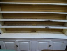 Painted pine dresser having a four shelf open rack and four base drawers, 226 cms wide, 190 cms