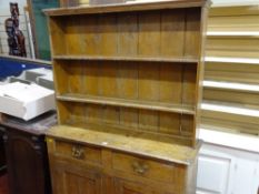 Compact pine dresser for full restoration having a twin shelf rack over a base of two drawers and