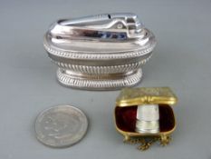 Gilt metal floral decorated thimble purse, a Ronson table lighter and a 1981 Charles & Diana