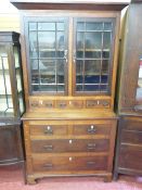 Early to mid 19th Century Anglesey oak and mahogany bookcase chest, having twin twelve pane upper