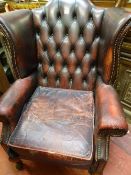 Button backed burgundy 'Ox Blood' leather wingbacked armchair