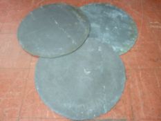 Three circular slate crock lids, 59 cms diameter the largest