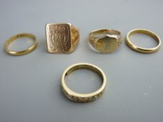 Five rings - a twenty two carat gold narrow wedding band, 2 grms, an unmarked narrow wedding band,