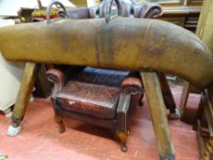 Early 20th Century leather bound gymnast's vaulting horse with twin iron handles and splayed pitch