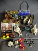Mixed collection of various perfume bottles, Nao figurines, Poole dolphin, costume jewellery etc