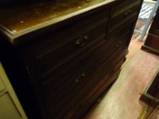 Edwardian chest of two short over three long drawers with rail back, 98 cms high, 106 cms wide, 51.5