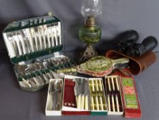 Iron based oil lamp, cased binoculars and assorted flatware