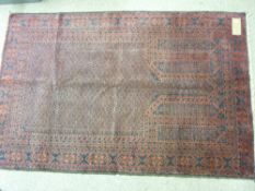 Old Belouchi rug, red ground with open central panel and multi-bordered edge, 145 x 94 cms