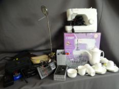Boxed electric Singer sewing machine, a fifteen piece Royal Albert coffee set, Panasonic movie
