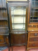 Circa 1900 mahogany glass topped display cabinet with bow front cupboard base on tapering reeded