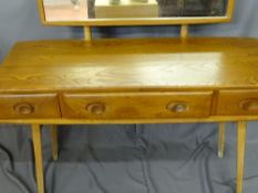 Ercol light wood oblong dressing table with three opening drawers and an open base