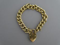 Nine carat gold link bracelet with a heart shaped locket, 56.5 grms gross