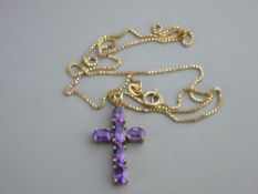 Nine carat gold crucifix of six oval amethysts with fine link box chain, 4 grms