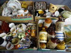 Four large boxes of miscellaneous household items including Teachers Whisky jar, Taunton Vale