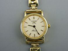 Lady's circular dial nine carat gold encased Longines wristwatch with attractive nine carat gold