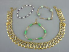 Large yellow metal necklet of four shaped oval drops, a nine carat gold and jadeite bracelet with