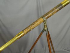 Antique brass and leather two draw telescope on a tripod base by W Gregory of The Strand, London