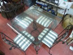 Modern Italian style wrought iron and glass top conservatory table and four chairs with