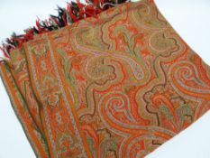 A NORTH WALES SQUARE COTTON PAISLEY SHAWL intricately embroidered and with fringed border, approx