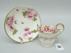A FINE NANTGARW PORCELAIN CUP & SAUCER footed and with inverted heart shaped handle, gilt dentil rim