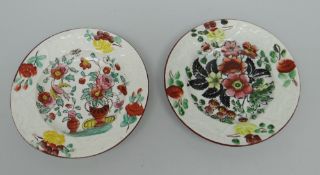 A GOOD PAIR OF BAKER, BEVANS & IRWIN CHILD'S PLATES with floral decoration and moulded borders