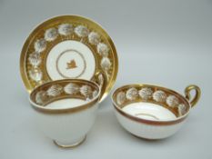 A SWANSEA PORCELAIN PARIS FLUTE CRESTED TRIO the border decorated with shell reserve in gilding