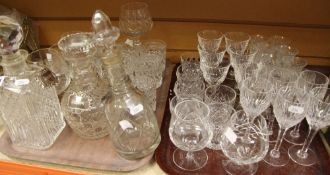 A QUANTITY OF MIXED CUT GLASS DRINKING GLASSES AND DECANTERS