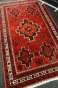 A PERSIAN CARPET from Postkohi, 100% wool pile, 244 x 143cms