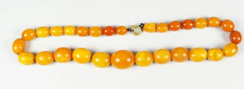 GRADUATED STRING OF AMBER BEADS, 38cms long approx. 28 grams approx.