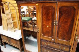 AN ANTIQUE TRIPLE WARDROBE with bank of centre drawers and matching marble top wash stand (