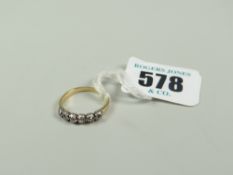 YELLOW METAL SIX-STONE DIAMOND RING