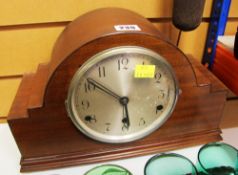 A POLISHED MANTEL CLOCK in the Art Deco style with circular dial