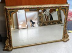 A FANCY PAINTED AND GILDED OVERMANTEL MIRROR