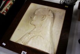 A FRAMED PLASTER RELIEF PORTRAIT entitled 'Amy'