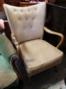 A VINTAGE WOODEN ARMED CHAIR with buttoned back in cream leatherette covering and a HK maker's